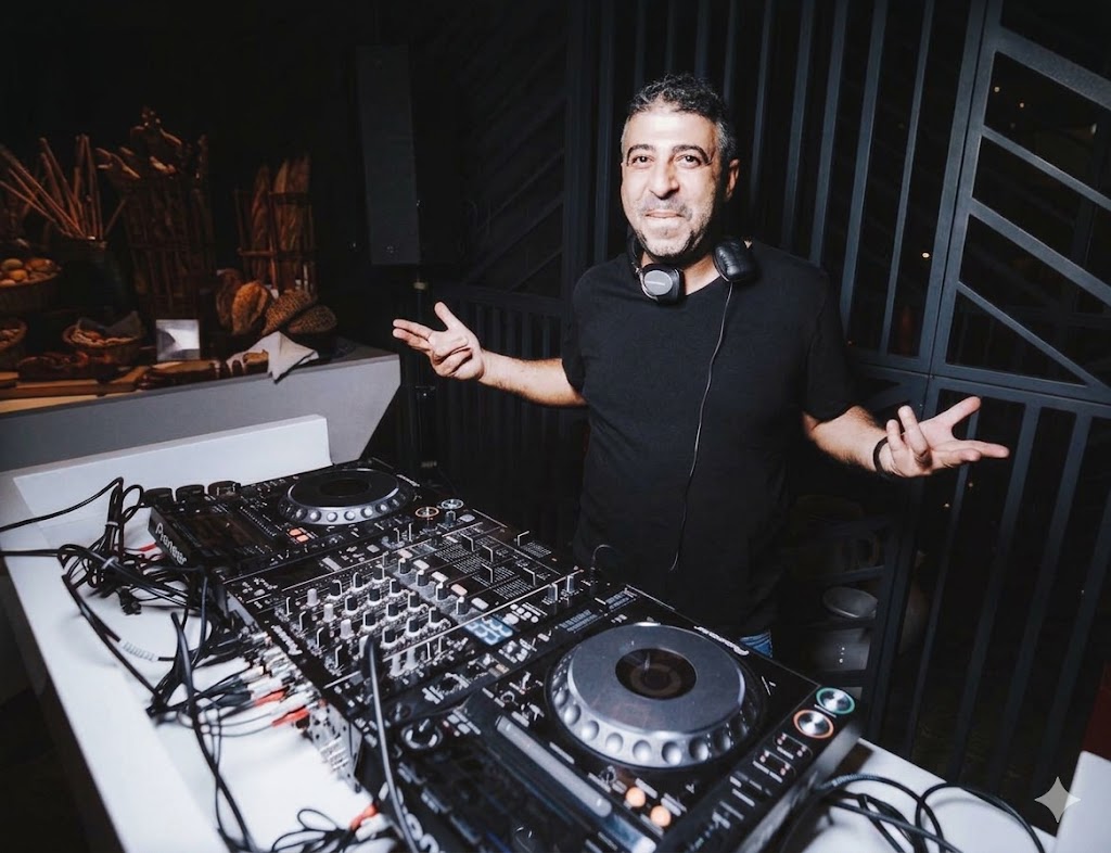 Richard Hussein behind the decks DJ set